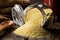 Heap of raw, uncooked couscous in glass jar on wooden table