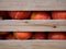 Heap of Red Hokkaido Pumpkins, Cucurbita maxima, In A Wooden Crate