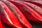 Heap of red kayaks as abstract background