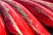 Heap of red kayaks as abstract background