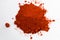 Heap of red pepper powder isolated on white background