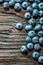 Heap of ripe bilberries on vintage wooden background