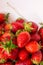 Heap of Ripe Organic Garden Strawberries Washed in Colander with Glossy Surface Texture. Summer Vitamins Preparing Preserves