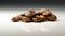 a heap of rosted coffee beans on a white background