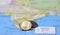 Heap of Rupee Indian money coins on the india map. Concept of finance or travel
