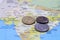 Heap of Rupee Indian money coins on the india map. Concept of money finance.