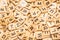 Heap of scrabble tile letters from above