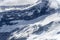 Heap of snow and black cliffs at Popes Nose peak,  New Zealand