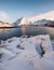 Heap snow with fishing village in snowy mountain at coastline