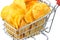 Heap of tasty crisp potato chips, snack in metal trolley, cart on white background