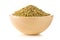 Heap of uncooked, raw freekeh or firik, roasted wheat grain, in wooden bowl over white