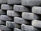 Heap of used car tyres background