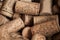 Heap of used vintage wine corks close-up.