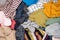 Heap of various colourful clothes such as sweaters, trousers and shirts