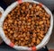 Heap of very dried apricots in bag on fair