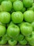Heap of Vivid Green Apples, Vertical Photo for Background