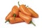 Heap of whole fresh orange mini pointed bell peppers close up on white background