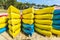 Heap of yellow and blue kayaks in Costa Brava, Spain