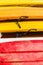 Heap of yellow and red kayaks as abstract background