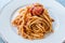 Heaped Plate of Classic Italian Pasta Spaghetti with Basil and Tomato Sauce