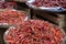 Heaps of dried chilies in baskets