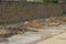 Heaps of earth and clay from a trench pit on a road