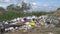 Heaps of plastic trash on the shore of the reservoir. Environmental pollution. Ecology of nature, unorganized garbage dump.