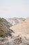 Heaps of sand at a construction site on an overcast day