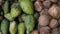 Heaps of soursop and coconut fruit in a traditional market