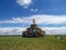 Heaps of stones Aobao build on a vast pasture in Xilinhot in Inner Mongolia. The Heaps has a lot of colorful prayer flags