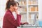 Hearing impaired woman working with laptop