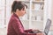 Hearing impaired woman working with laptop