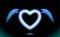 Heart anime neon with wings, blue glow radiant effect of love with space for Valentines day. Decorative holiday design, night