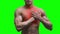 Heart attack, elderly muscular man with infarction on green background, chroma key 4K video