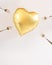 Heart balloon gold with forks all around it trying to poke it. Valentine love hurts concept idea