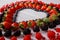 Heart of berries on wooden background