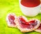 Heart biscuits with jam on green table