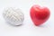 Heart and brain figures lie next to each other on white background. Visualization of connection between brain and heart, choice in