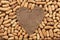 Heart of burlap, lies on a background of peanut