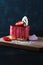 Heart Cake picture . Lovely delicious heart cake. A red colored cheesecake on a plate and a wooden table.