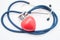 Heart care and protection. Medical stethoscope folded into ring, surrounds shape of human heart, symbolizing protection, research,