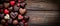 Heart chocolate pralines elegantly placed on a dark brown wooden table, Ai Generated