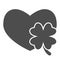 Heart with clover leaf solid icon. Love symbol and Patrick day shamrock glyph style pictogram on white background. Saint