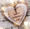 Heart composition for Valentine Day. Wooden hearts on old white desk.