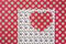 Heart cut out on an abstract-patterned paper