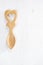 Heart design wooden spoon on white wood backdrop