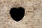 Heart on dirt wall