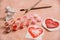 A heart drawn by lipstick, with more hearts made of powder and blush. \'Love makeup \' valentine card with a professional brush
