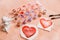 A heart drawn by lipstick, with more hearts made of powder and blush. \'Love makeup \' valentine card with a professional brush
