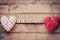 Heart fabric and wooden text I LOVE YOU on wooden table background.